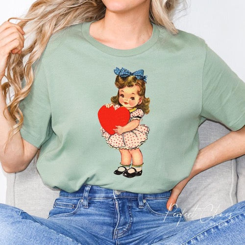 Little girl holding a heart